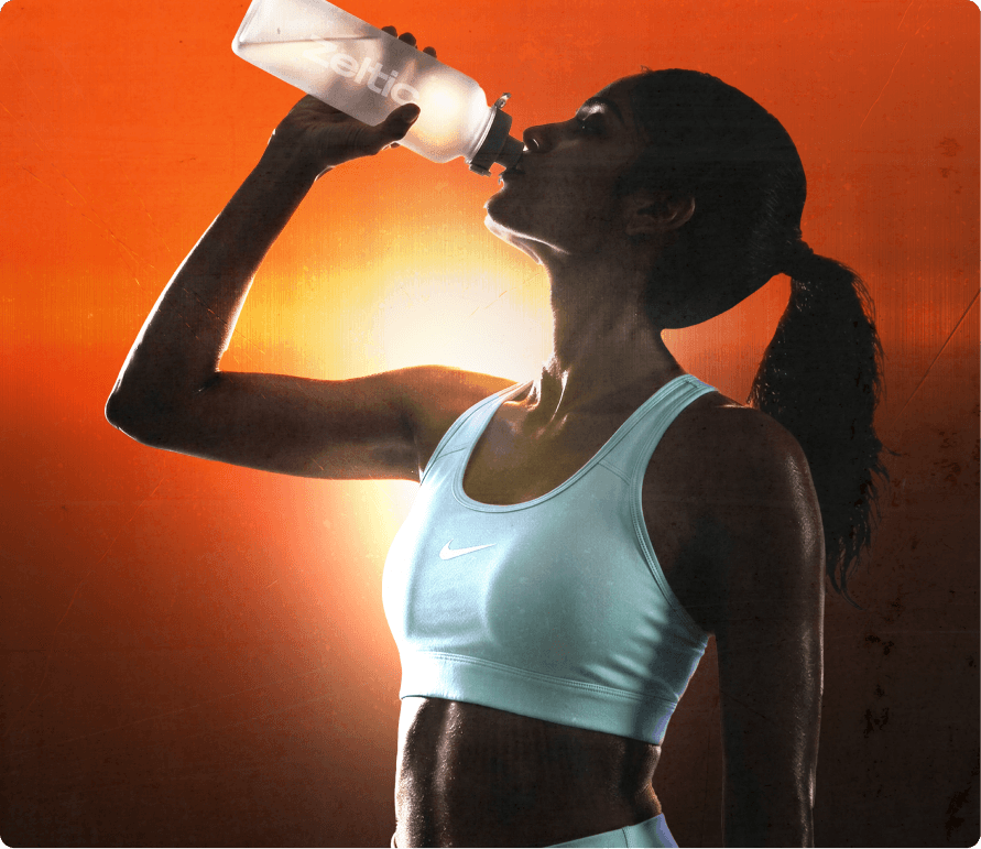 Athlete drinking water in heat